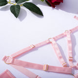 A lingerie set featuring ribbons, mesh, see - through elements and cut - outs, perfect for intimate moments.